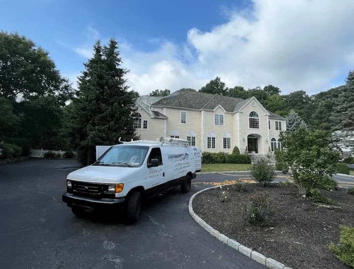 Berea Power Washing technician performing thorough gutter cleaning service in Berea