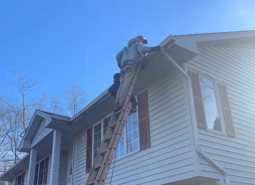 Gutter cleaning and maintenance being performed by Berea Power Washing in Berea